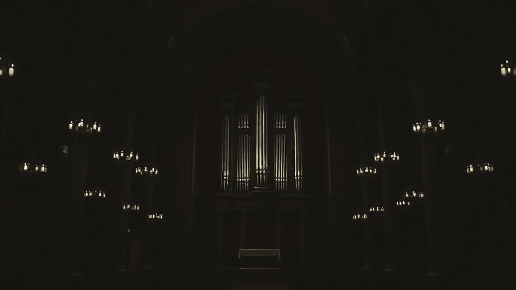 Dark black-and-white Italian basilica with pipe organ